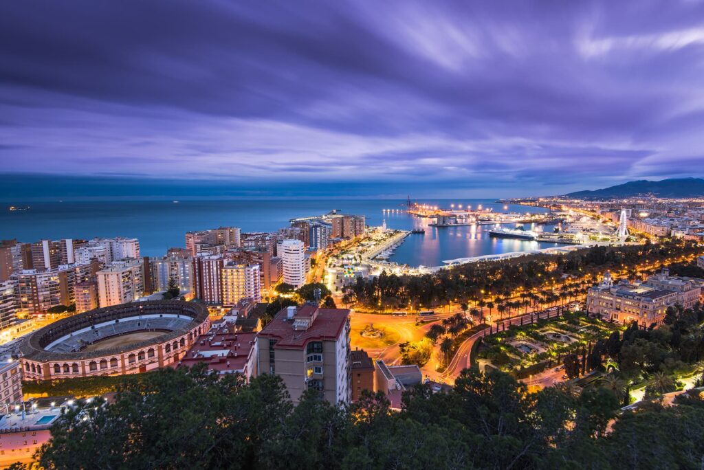 Málaga port and city lights at night