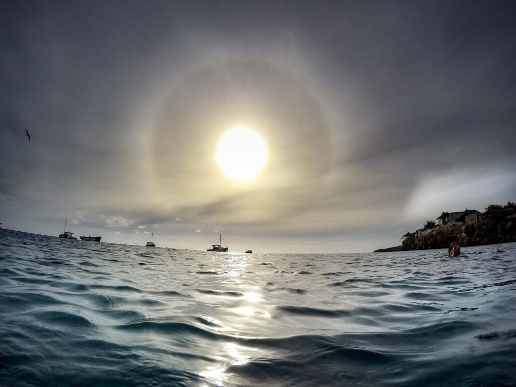 Snorkelling under an eclipse sunbow