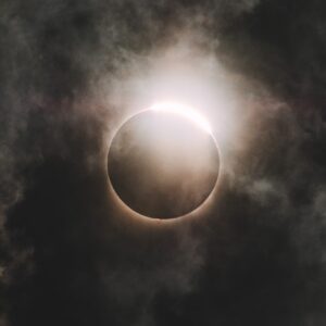 Solar eclipse illuminating a dark sky